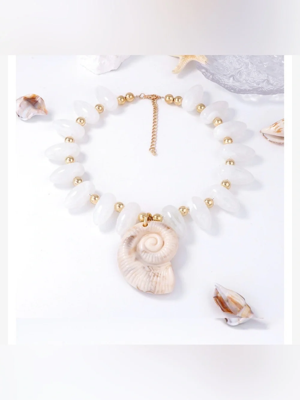 A Classy Chic Boutique White Shell Spiral Pendant Necklace with Gold Beads